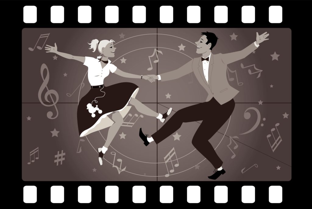 Couple dancing 1950s style rock and roll in an old movie frame
